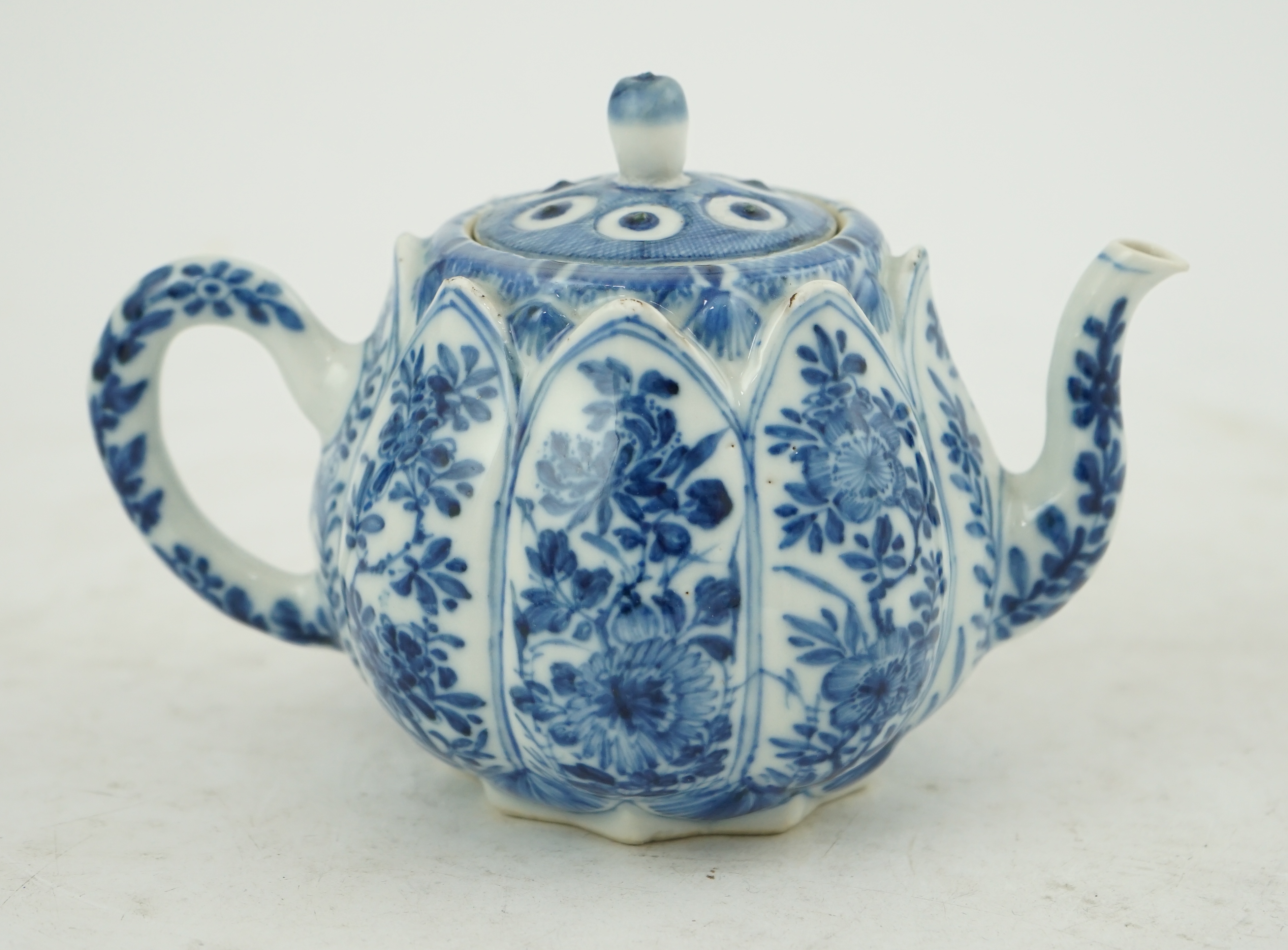 A Chinese blue and white lotus pod-shaped teapot and cover, Kangxi period